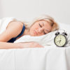 How Are You Sleeping? Woman Sleeping Next To Alarm Clock